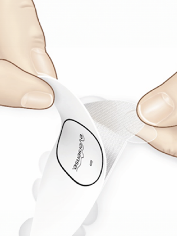 Hands peeling a breathable adhesive bandage with "Absorbene" text, in preparation for use